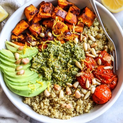 Zesty, bright serving: Roasted Sweet Potato Pesto Quinoa Grain Bowl with Lemon Zest.