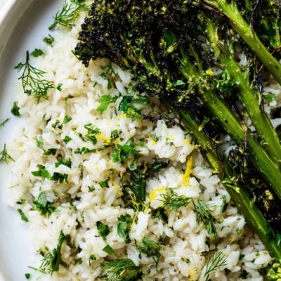 Fluffy garlic herb jasmine rice alongside smoky charred broccolini finished with cracked pepper
